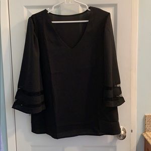 Black bell sleeved top